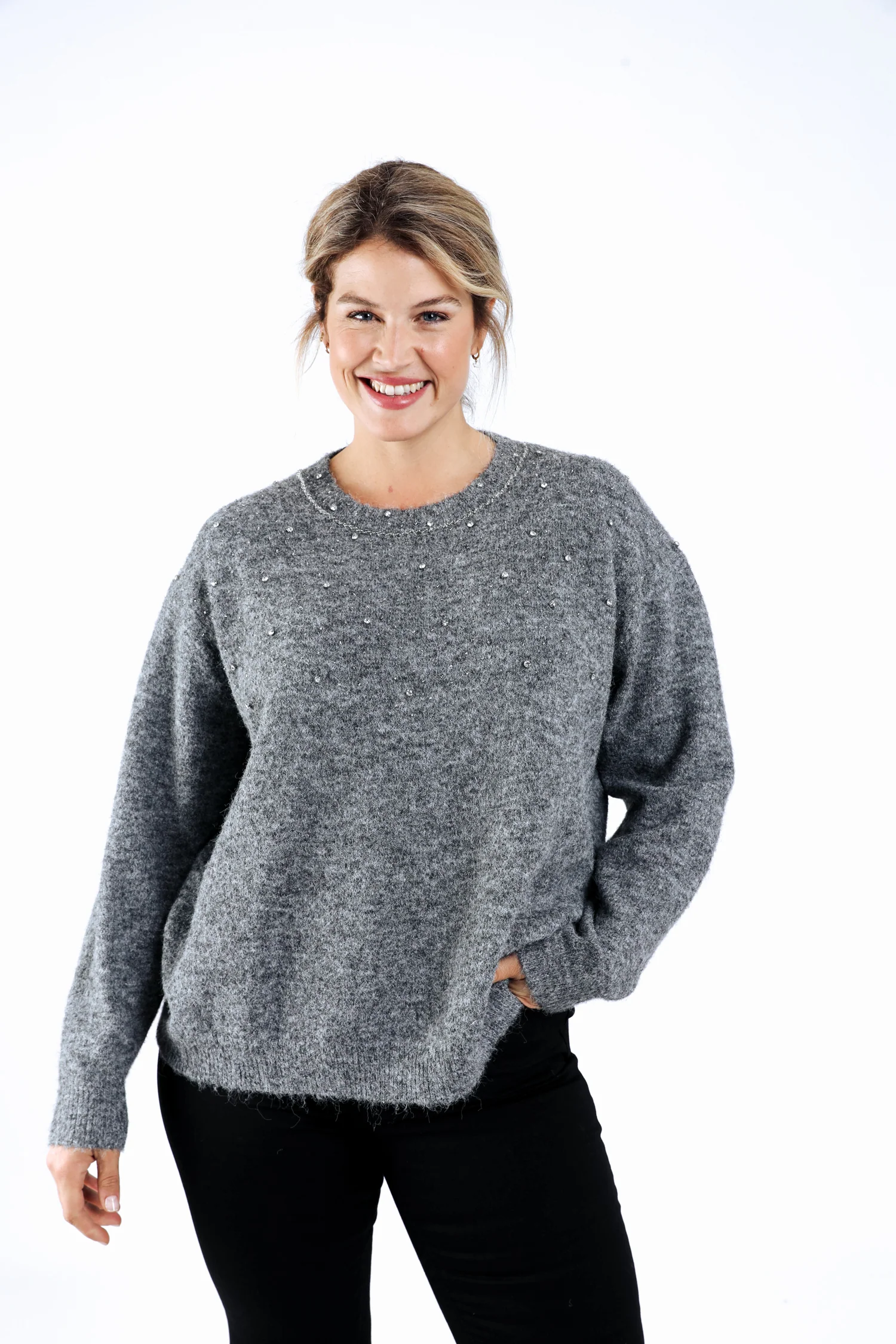 Effen trui met strassdetails